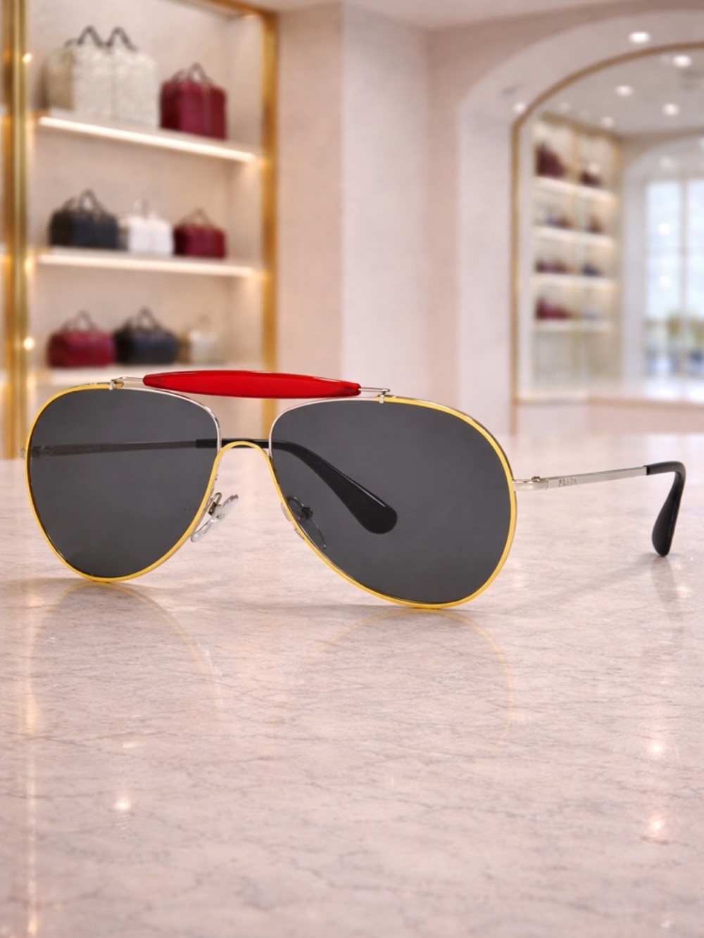 Prada Gold Frame Sunglasses with Black Lenses